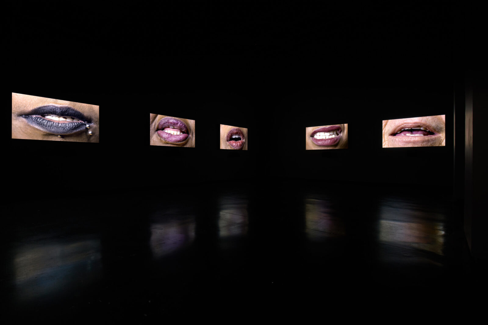 Candice Breitz, Sweat (2018). Featured here: Zoe Black, Emmah, Gabbi, Connie, Jennie. Installation view at FACT. Photo by Rob Battersby.